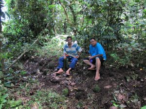 Petelu and Matiu Matavai Tautunu of the National University of Samoa on a mound, Lal-16, in Lalomanu.